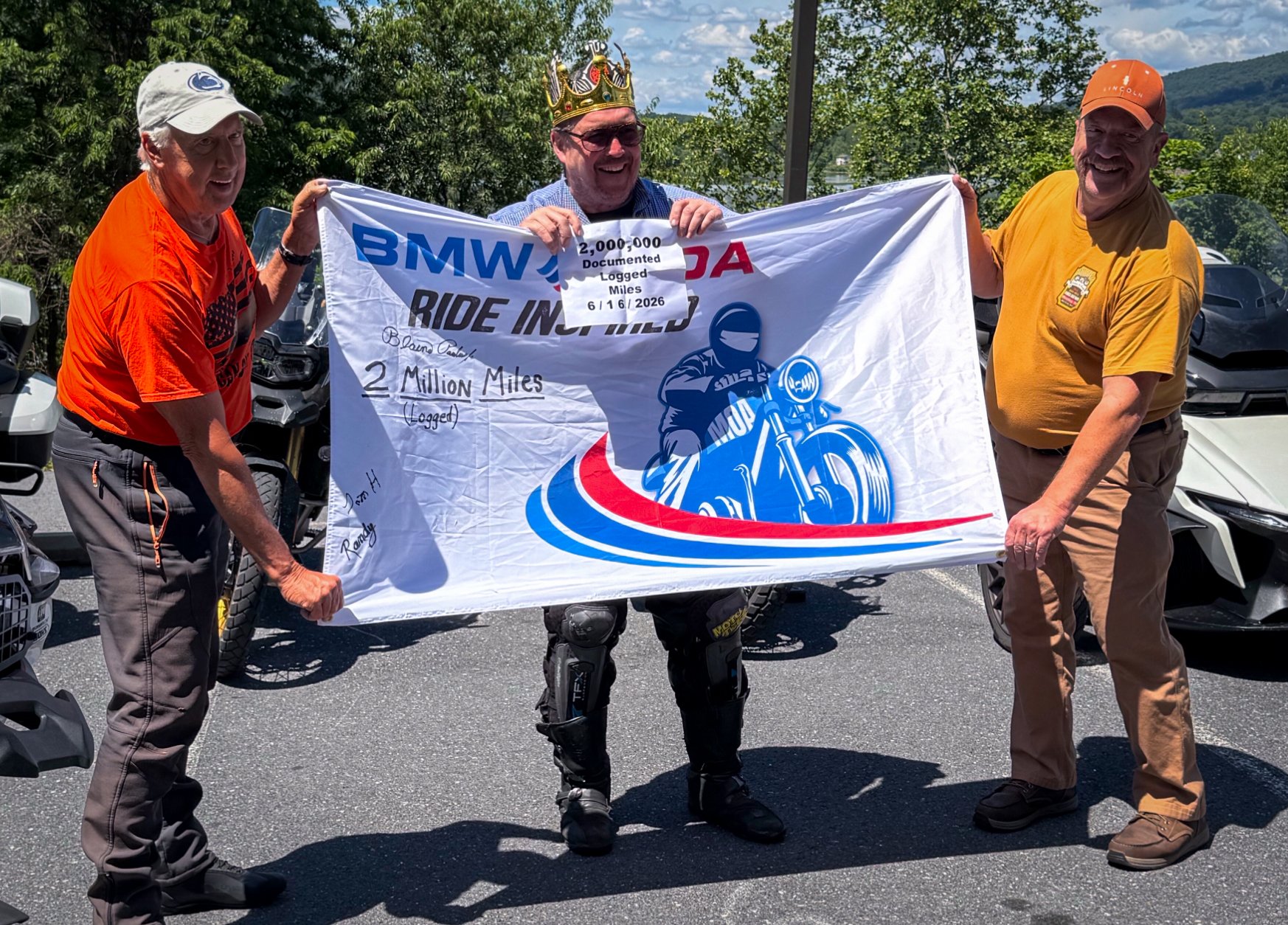 Blaine Paulus Jr. celebrating two million documented motorcycle miles with fellow riders